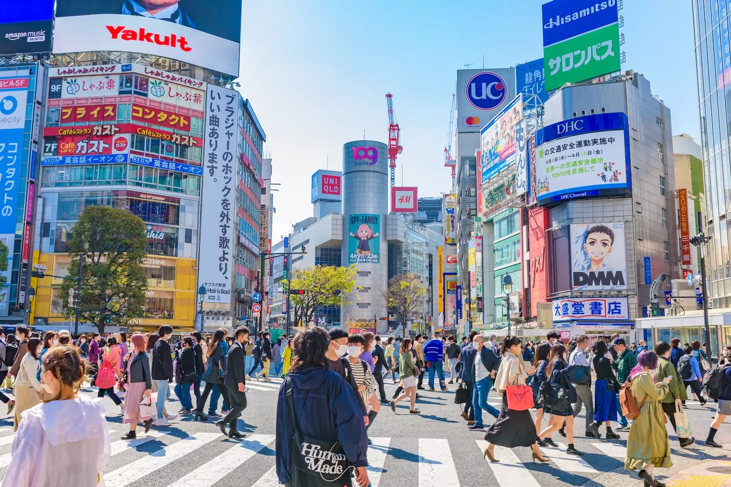 Bustling streets of Tokyo with people walking through the intersection