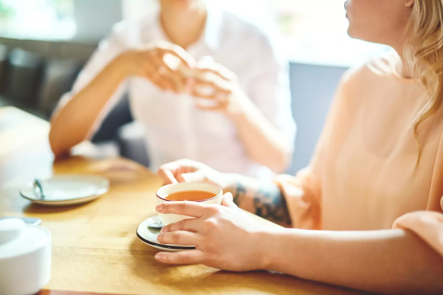 A Christian shares the gospel with an unbelieving friend over coffee.