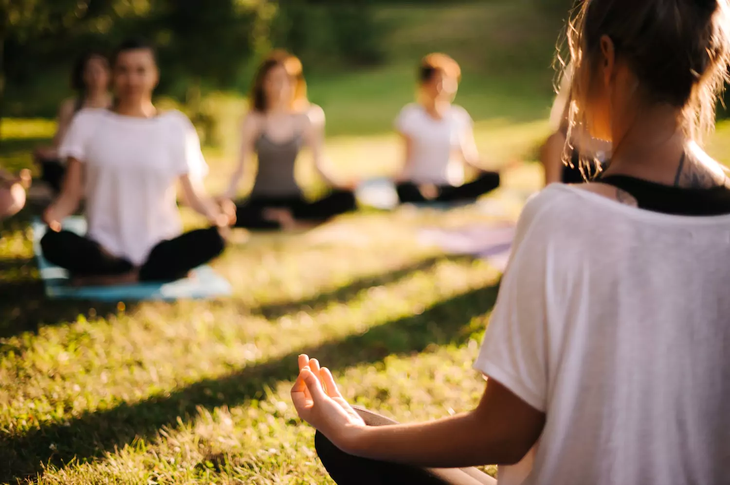 A woman teaches other women yoga, embracing the new age philosophy that the church must reject.