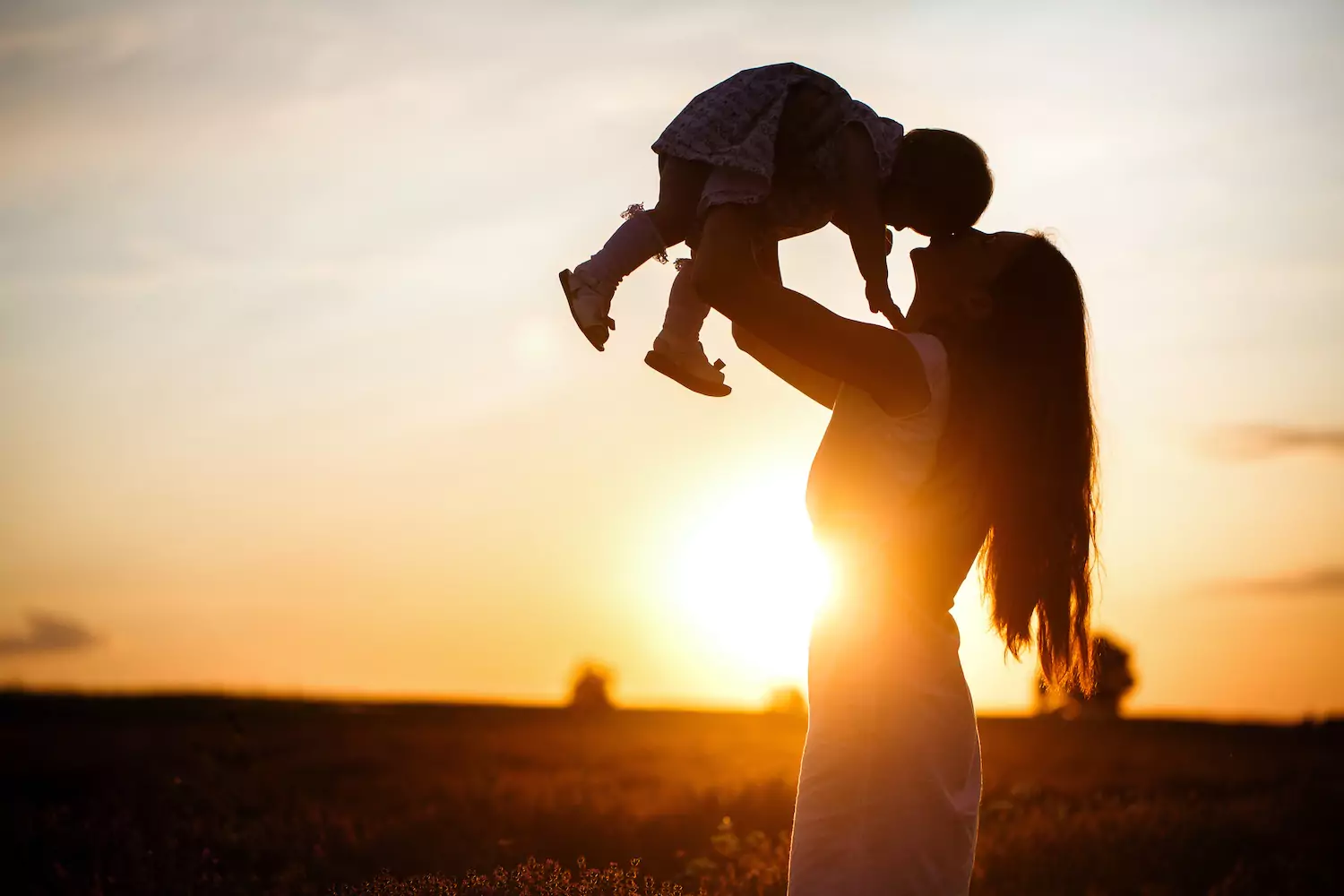 A mother with her son, reminiscent of Mary with Jesus.