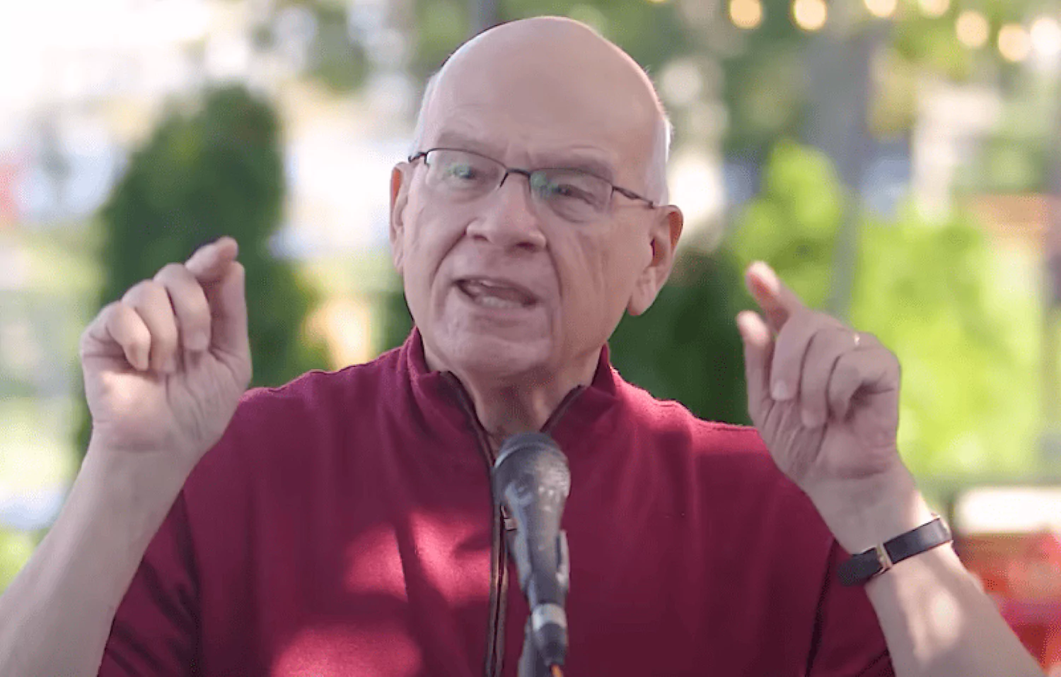 Tim Keller speaking to a camera, using his hands for emphasis.