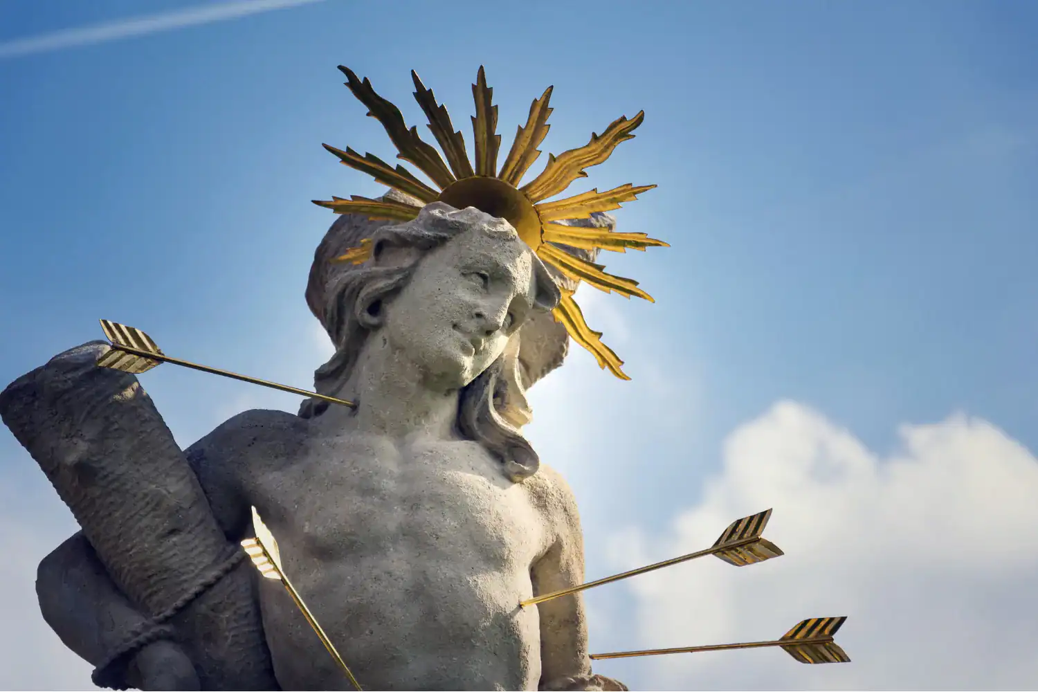 Statue of Sebastian the Martyr pierced by arrows, symbolizing the biblical truth “blessed are the persecuted.”